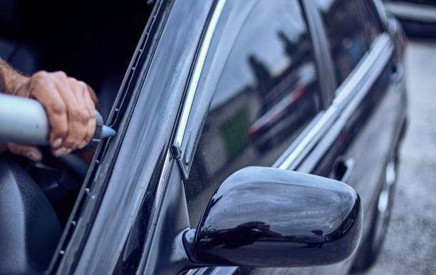 istock Replacing the glass on the service on a black car. 845295896