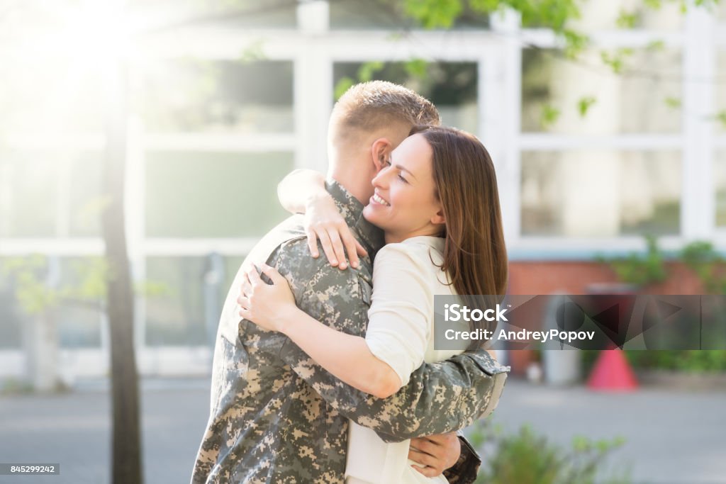 Happy Wife Hugging Her Husband Portrait Of Happy Wife Hugging Her Husband In Army Uniform Military Stock Photo