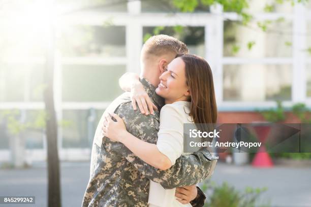 Happy Wife Hugging Her Husband Stock Photo - Download Image Now - Military, Husband, Wife