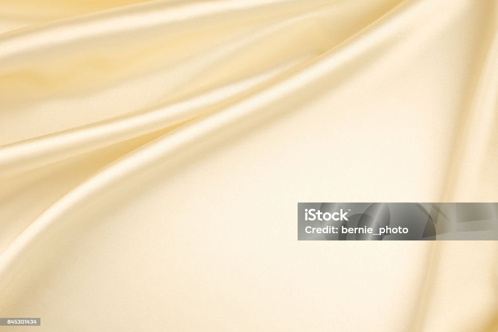 Gold silk fabric background abstract background luxury cloth or liquid wave or wavy folds of grunge silk texture satin velvet material or luxurious Christmas background or elegant wallpaper design Gold - Metal Stock Photo