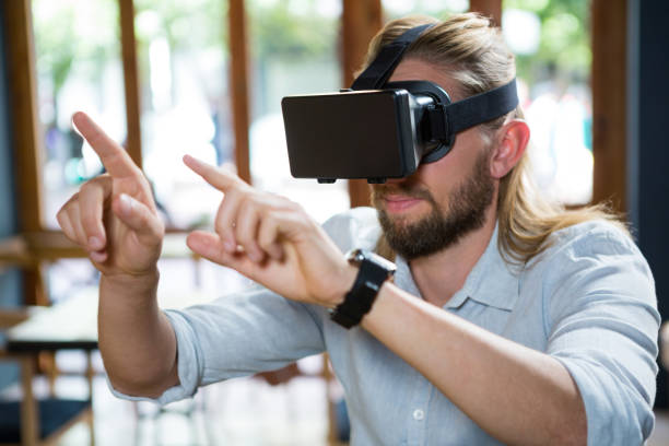 istock Man wearing virtual glasses in coffee shop 845304984