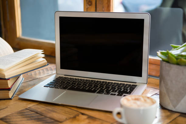 istock Laptop with blank screen in coffee shop 845307684
