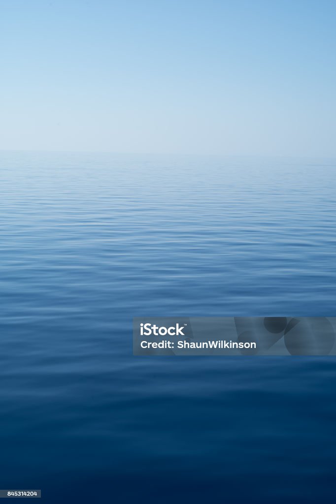 Imagen de fondo del mar llano - Foto de stock de Mar libre de derechos