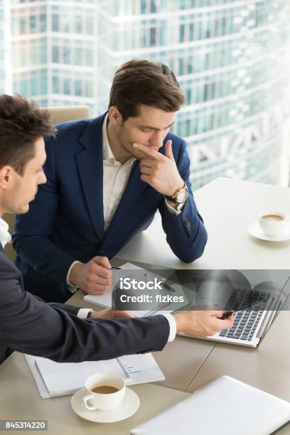 Entrepreneurs Discussing Work Results On Meeting Stock Photo - Download Image Now - Discussion, Employee, Manager