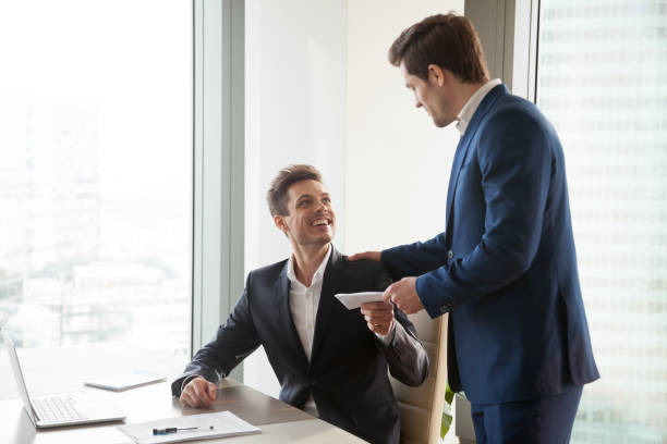 Boss giving money premium to happy employee