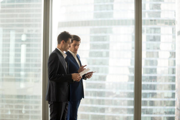 istock Boss giving instructions to company employee 845314448