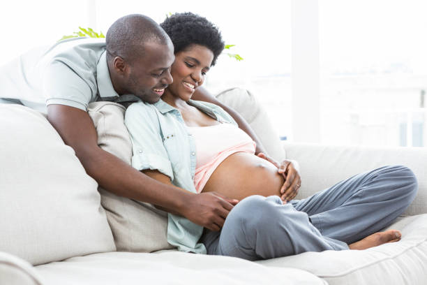 istock Man touching pregnant womans stomach 845317234