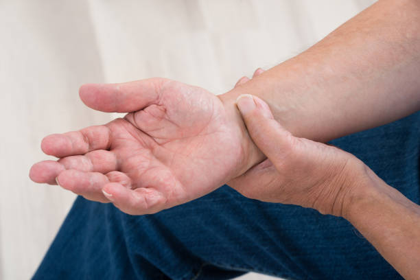istock Person Holding Painful Wrist 845319972