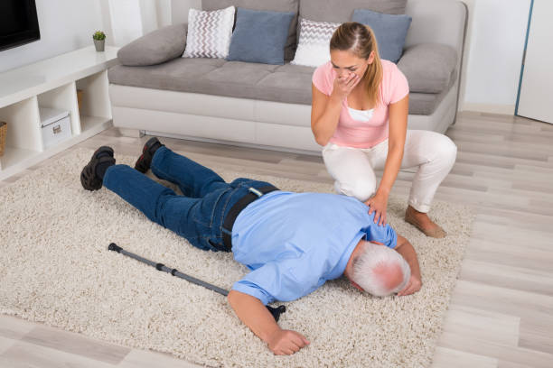 istock Woman Looking At Her Fainted Disabled Father 845322218