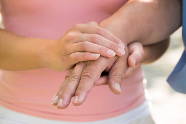 istock Woman Holding Man's Hand 845323384