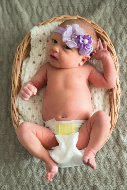 istock Baby Wearing Purple Headband 845335262