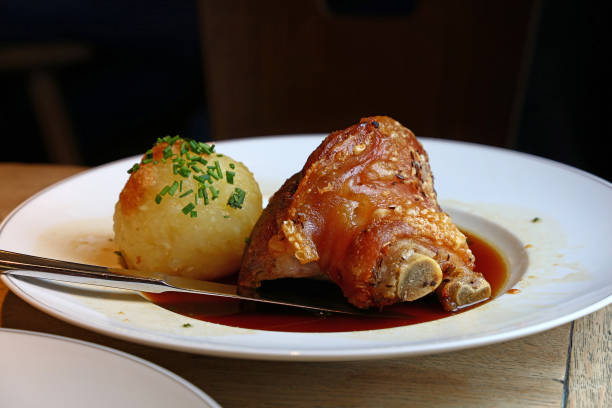 istock Portion of roasted pork shank with dumplings 845338760