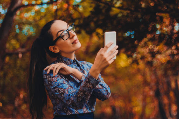 istock Businesswoman in park 845340484
