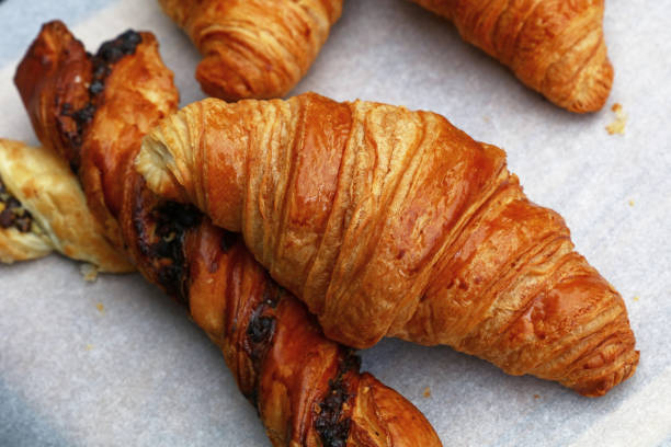 istock Freshly baked golden croissants close up 845342088