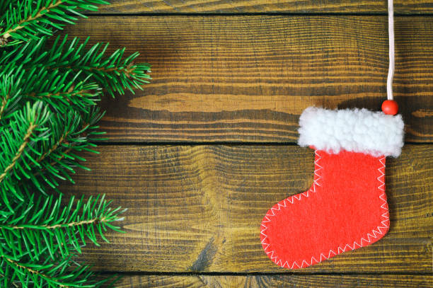 istock Christmas stocking on wooden background 845348534