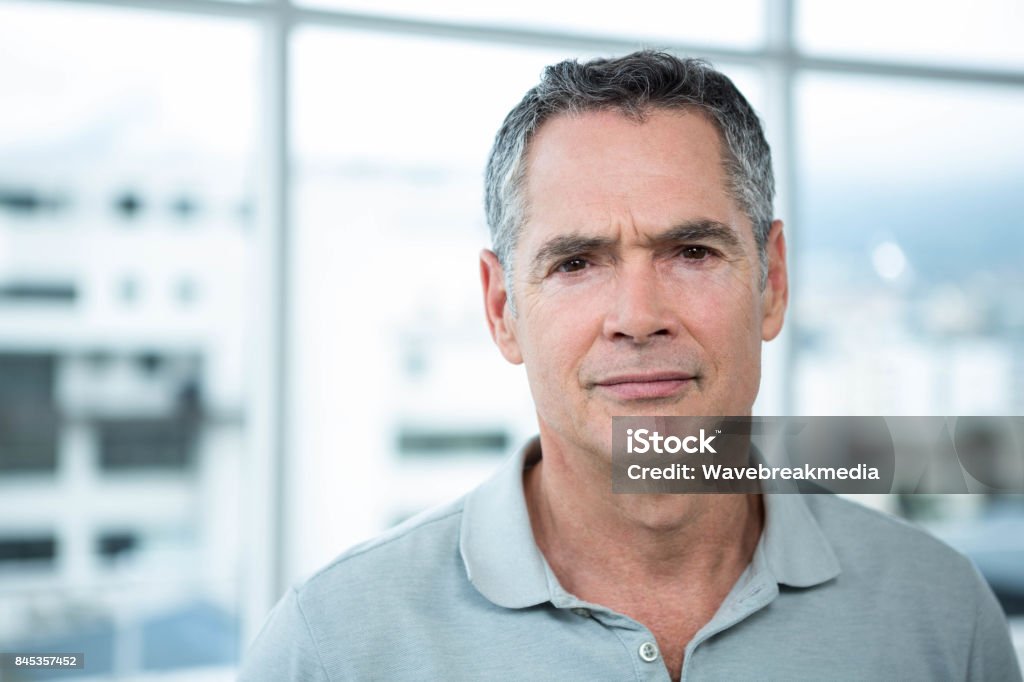 Man looking at camera Close-up of man smiling at camera Men Stock Photo
