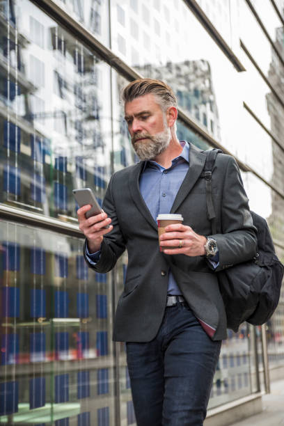 istock Businessman walking on the street 845364278