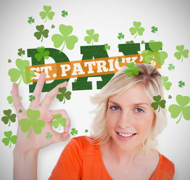 istock Blonde giving ok symbol for st patricks day with text and shamrocks 845367266