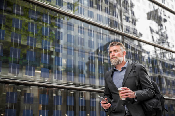 istock Businessman walking on the street 845367364