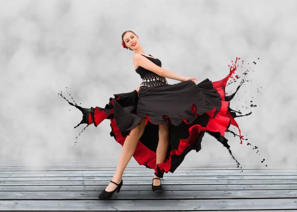 istock Flamenco dancer with dress turning to paint splashes 845381494