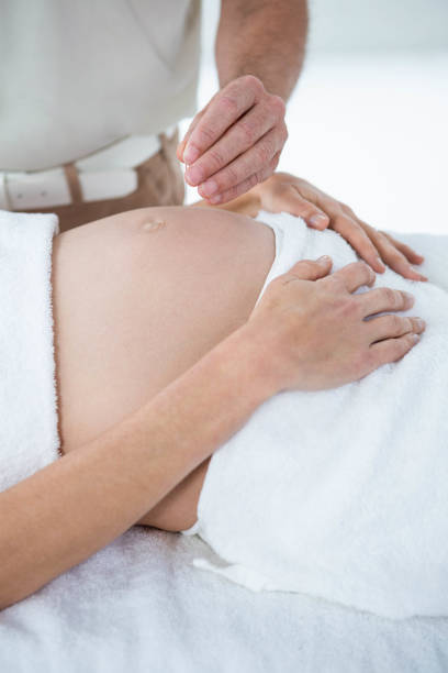 istock Pregnant woman in an acupuncture therapy 845384864