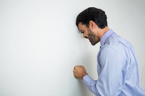 istock Stressed businessman at conference centre 845388110