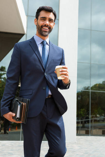 istock Portrait of businessman holding disposable cup and diary 845396816