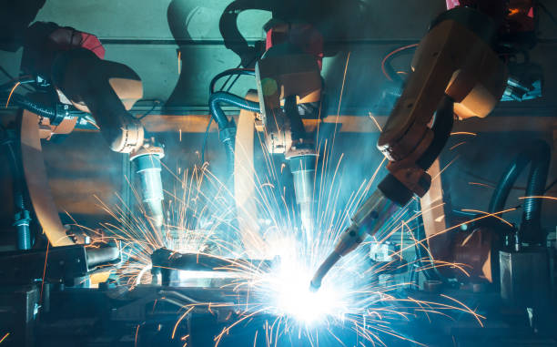 istock Welding robots movement in a car factory 845399734