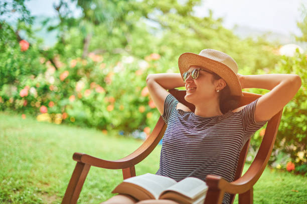 istock Smiling woman in summer sunny background 845399818