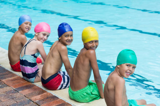 istock Happy of friends sitting at poolside 845422794