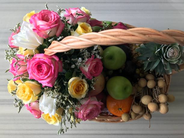 istock Fruit basket with colorful flower 845423938