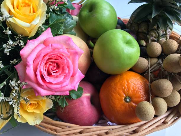 istock Fruit basket with colorful flower 845423962