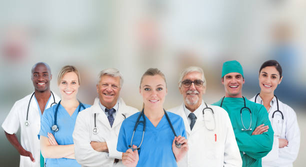 istock Smiling medical team standing in line 845429494