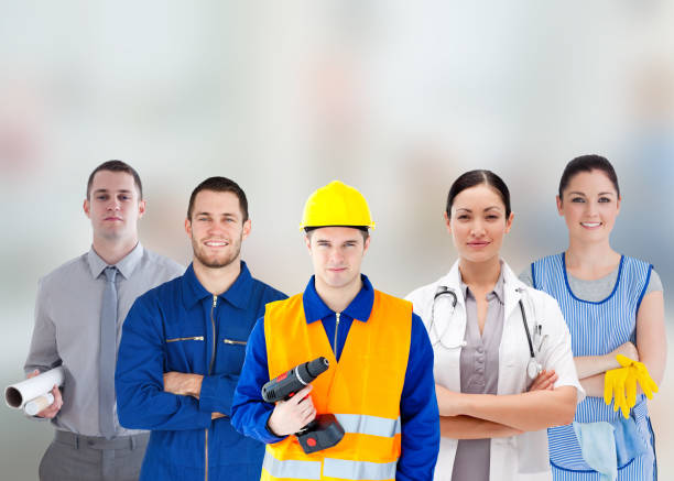 istock Smiling people with different jobs standing arms folded in line 845432230
