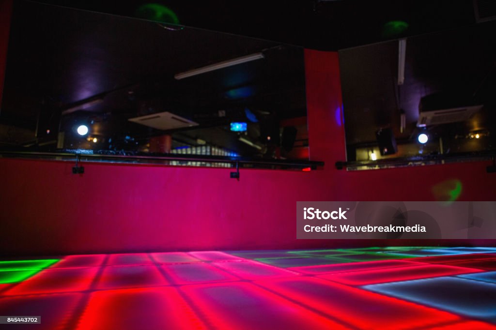 Red illuminated disco dance floor Red illuminated disco dance floor in bar Dance Floor Stock Photo