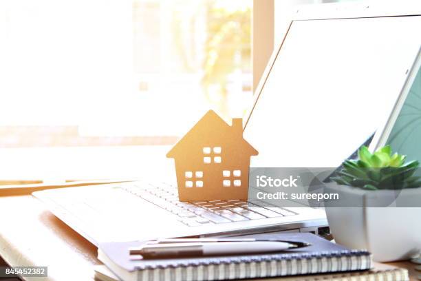 Wood House Model On Computer Laptop Stock Photo - Download Image Now - Real Estate, House, Mortgage Loan