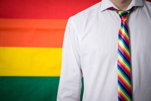 istock Man wearing shirt and rainbow tie 845452976