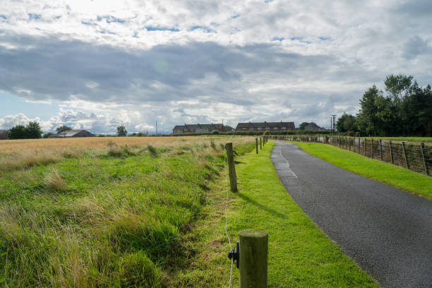 istock Crooked road to distant suburbs in england 845461700