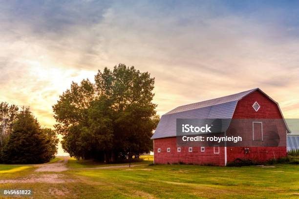Red Barn At Sunset Stock Photo - Download Image Now - Barn, Farm, Red Barn