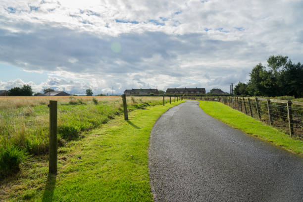 istock Crooked road to distant suburbs in england 845461838