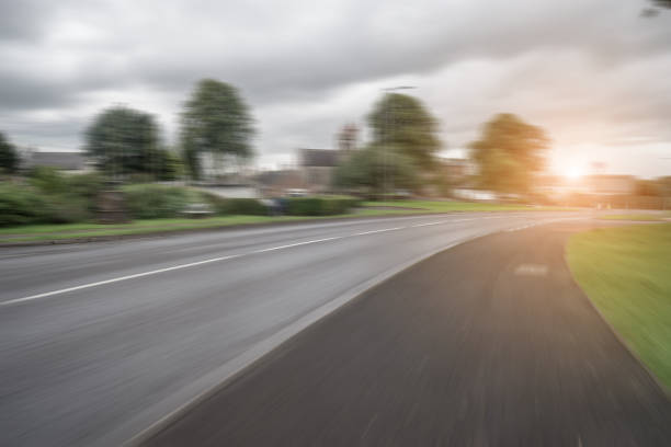 istock Crooked road to distant suburbs in UK 845461980