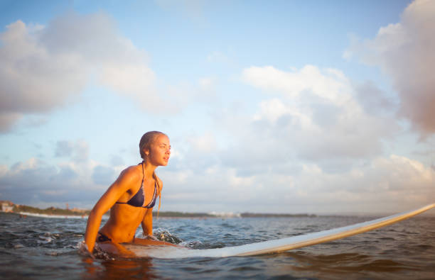 istock young surfer woman 845464528