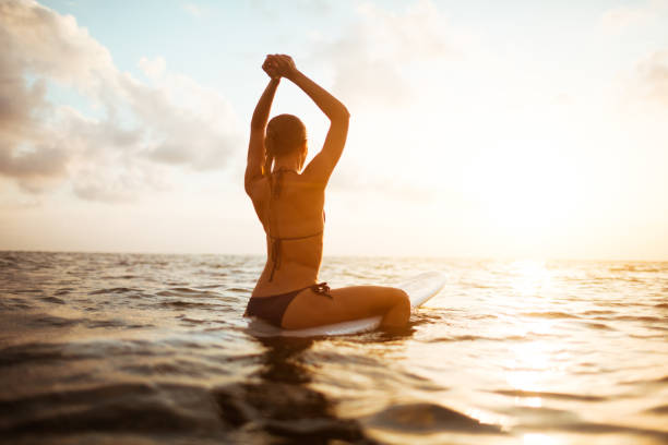 istock young surfer woman 845464534