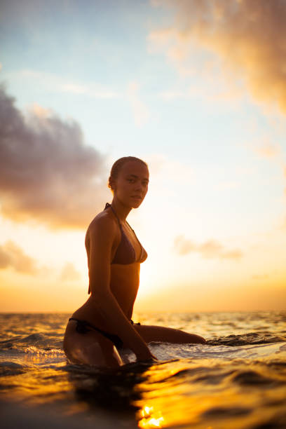 istock young surfer woman 845464544