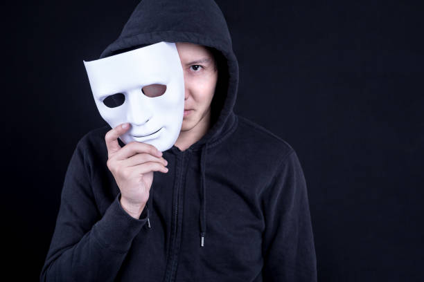 istock Mystery man holding white mask for hide his face 845464892