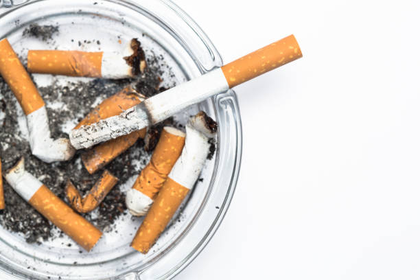 istock Overhead of burning cigarette in ashtray with copy space 845467798