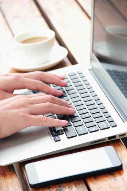 istock Female hand typing with laptop 845470590