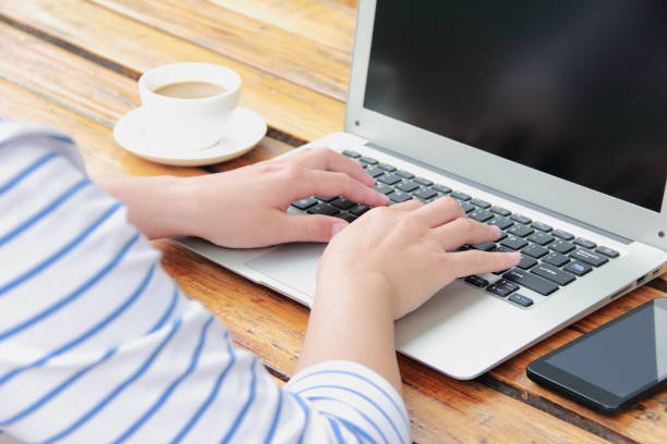 istock Female hand typing with laptop 845470592