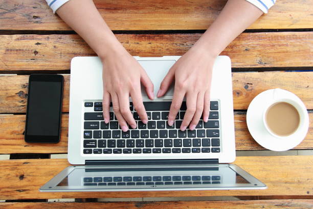 istock Female hand typing with laptop 845470752
