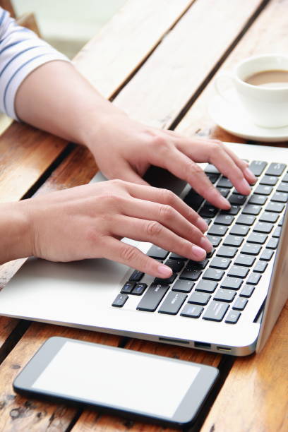 istock Female hand typing with laptop 845470784